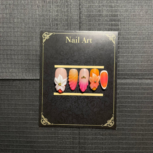 Faux ongles Coralia dégradé rose corail fleurs 3D dorées C'Sha Nails