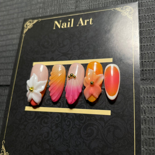 Press-on nails Coralia dégradé rose corail fleurs 3D dorées C'Sha Nails